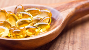 fish-oil-capsules-in-wooden-spoon